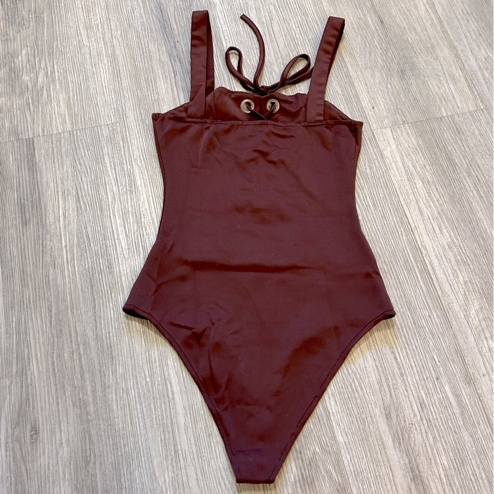 CHARLOTTE RUSSE burgundy one piece lace up bodysuit. New condition. Bottom snaps - Picture 3 of 6